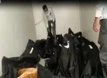 تصاویر منتشر شده از انباشت اجساد جانباختگان کرونا در مشهد/ FILM